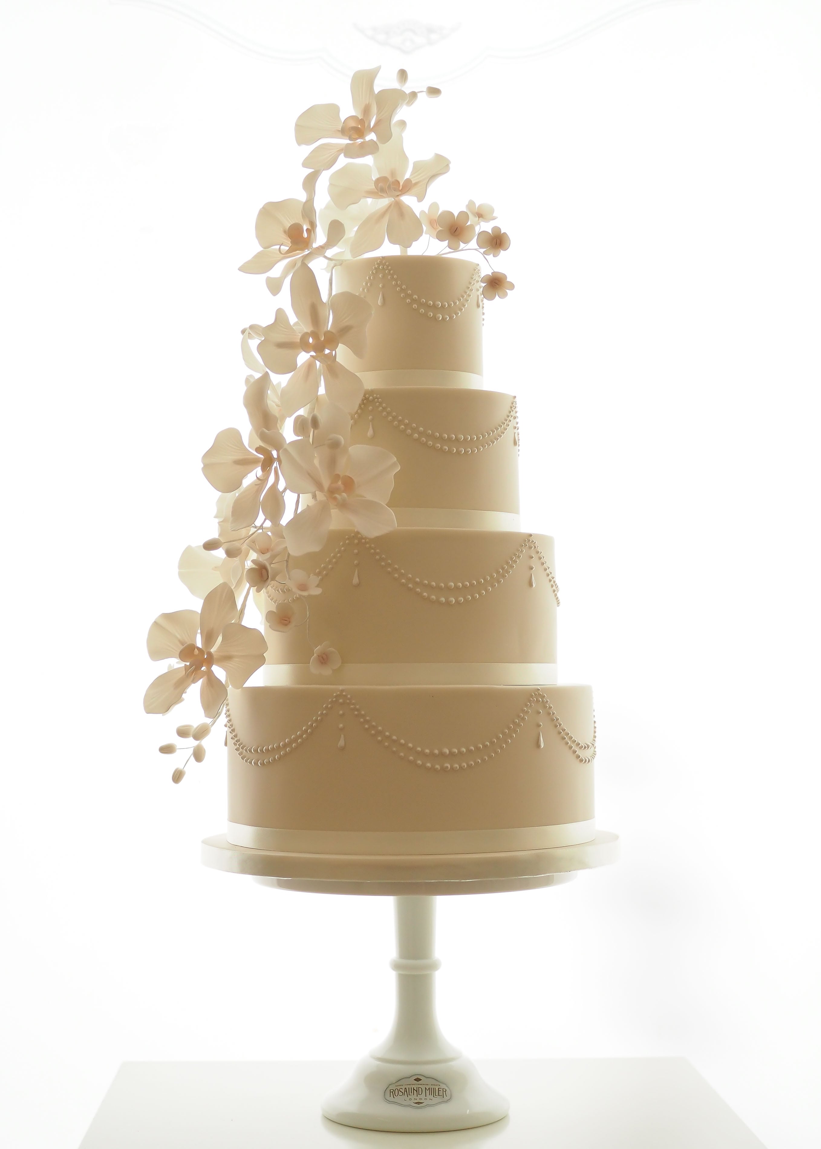 Orchids, Pearls and Drapes Wedding Cake with sugar flowers